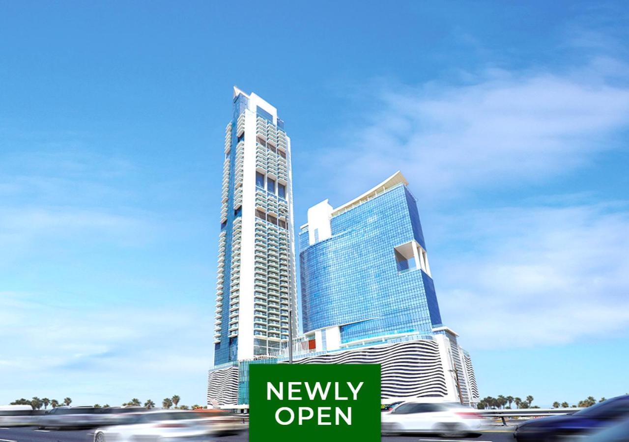 Movenpick Jumeirah Village Triangle Dubai Exterior foto The 101 Tower