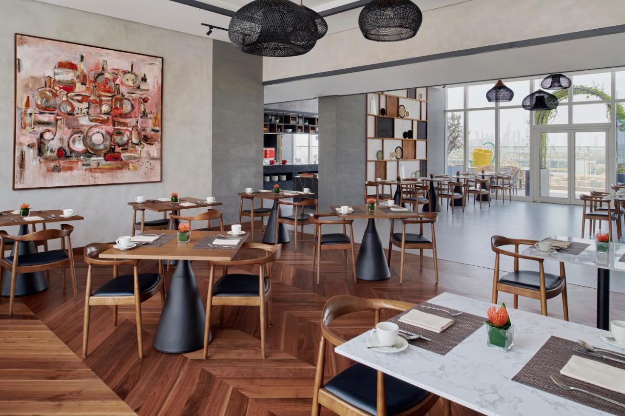 Movenpick Jumeirah Village Triangle Dubai Exterior foto The restaurant