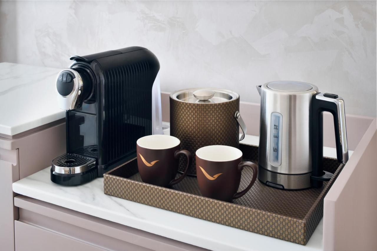 Movenpick Jumeirah Village Triangle Dubai Exterior foto A Nespresso coffee machine